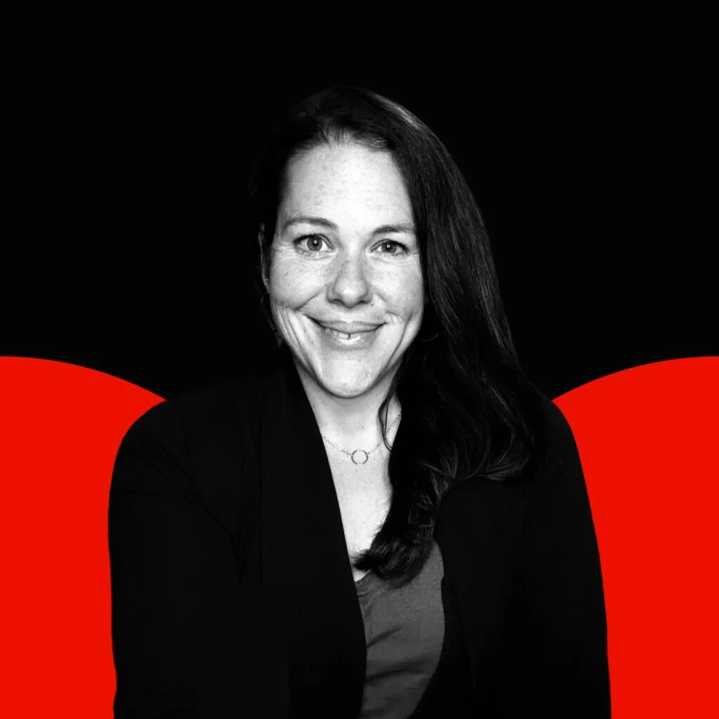 Black white photo of Kelly Navari with red semi circles in the background